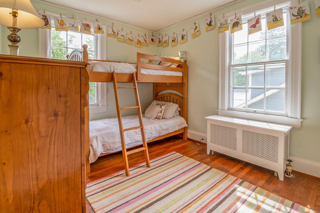 a bunk bed in a shared room for siblings